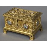 A Continental gilt metal cast casket The hinged cover and body with applied champleve roundels and
