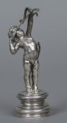 A Continental white metal desk seal Surmounted with the figure of cupid drawing his bow,