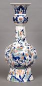 A 19th century polychrome decorated fluted vase The white ground decorated with birds amongst