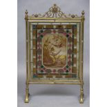 A Victorian brass framed stained leaded glass fire screen The pierced scrolling top rail above