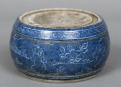 A Chinese blue and white porcelain ink stone Of circular section,