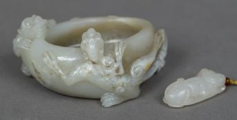 A Chinese carved pale jade brush washer Worked with a pair of salamander;