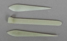 Three celadon jade hair pins Of typical form. The largest 9.5 cm long.