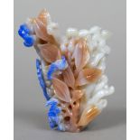 A Chinese carved agate group Worked as bats amongst foliage. 11 cm high.