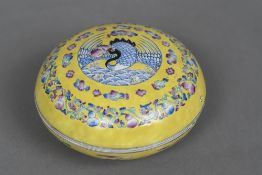 A Chinese porcelain circular box and cover Decorated with a bird within lotus strapwork,