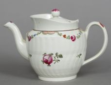 A Staffordshire creamware teapot and cover The spiral ribbed body decorated with floral sprays and