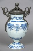 An early Delft drug jar Of ovoid form, with pewter handles and pierced lid, the front inscribed D.