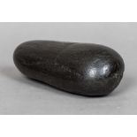 A Neolithic stone pounder By family repute found on the North Yorkshire Moors. 16.5 cm long.