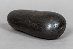 A Neolithic stone pounder By family repute found on the North Yorkshire Moors. 16.5 cm long.