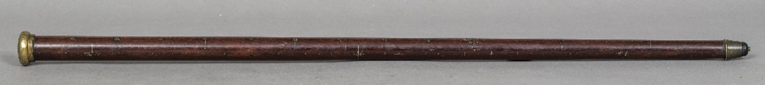 An unusual Chinese hardwood walking stick combination measuring stick The gilt metal pommel above
