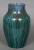 A Pilkingtons Royal Lancastrian art pottery vase Of flared ovoid form with turquoises glazes.