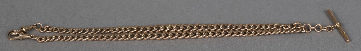 A 9 ct rose gold watch chain set with a T bar and two clasps 43.5 cm long.