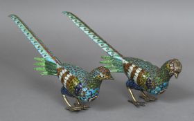 A pair of Chinese champleve and gilt metal pheasants Each naturalistically modelled. 37.5 cm long.