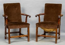 A pair of 19th century mahogany framed open armchairs Each padded back issuing twin scrolling open