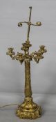 A 19th century ormolu candelabra The five scrolling branches above the acanthus and trailing vine