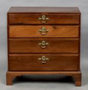 A George III mahogany chest of drawers The caddy top above four long graduated drawers standing on