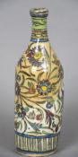 A 19th century Qajar pottery bottle Decorated with a deer amongst fauna. 29 cm high.