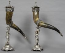 A pair of silver plated horn mounted cornucopia With pierced removable cherub finial lids,