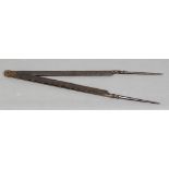 A pair of large early iron dividers, possibly related to shipping or tunnel excavation 72 cm long.