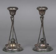 A pair of silver plated candlesticks by John Turton & Co.