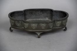 A 19th century Chinese patinated bronze censor Of lobed form with lappet decoration,