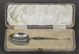 An unmarked enamel decorated anointing spoon Of typical form, with engraved bowl,