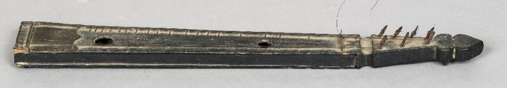 A 19th century Persian stringed instrument Of narrow box form with metal mounts. 70.5 cm long.