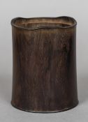 A Chinese carved wood brush pot Of circular section. 14 cm high.