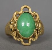 A Chinese 24 ct gold jade set ring The stone cabochon cut,