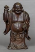 A 19th century terracotta model of Buddha Modelled standing in flowing robes holding a gourd. 54.