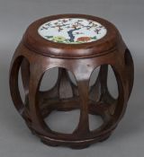 A Chinese porcelain inset hardwood seat Of barrel form, the seat floral decorated. 33 cm high.
