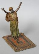 An Austrian cold painted bronze figure, probably Bergmann Modelled as an Arab at prayer,