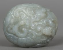 A Chinese carved white jade pebble Worked with mythical beasts and stylised clouds. 6.5 cm wide.