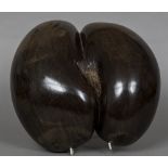 A polished coco de mer Of typical form. 32.5 cm wide.