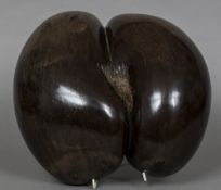 A polished coco de mer Of typical form. 32.5 cm wide.