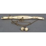 An unusual 19th century carved ivory implement Formed as twin collared hands, one side unscrewing,