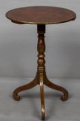 A Chinoiserie lacquered 19th century tripod table Decorated with gilt scenic vignettes on an iron