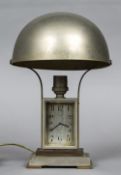 An Art Deco silver plated and brass desk/lamp combined timepiece The rectangular dial with Arabic