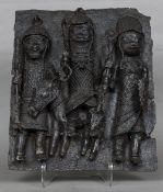 A large antique Benin bronze plaque Modelled as three figures, one seated astride a mule.