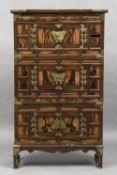 An early 20th century Chinese wooden cabinet Of four sectional form, with brass adornments.