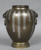 A bronze and silvered twin handled vase,