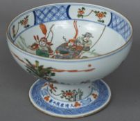 A Chinese porcelain footed bowl Polychrome decorated with figures in a continuous garden landscape,