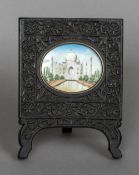 A 19th century miniature on ivory depicting the Taj Mahal Housed in a carved ebony frame. 10.