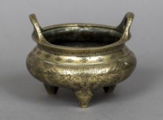 An Oriental bronze censor Decorated with five clawed dragons and calligraphy,