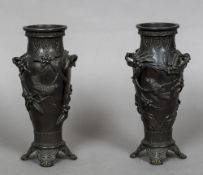 A pair of 19th century Japanese bronze vases Each worked with birds amongst fruiting boughs,