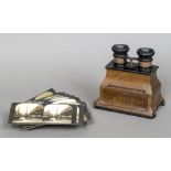 A late 19th/early 20th century walnut cased stereoscopic viewer Of typical hand held form;