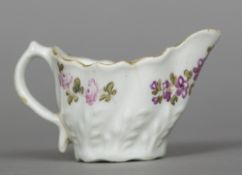 An 18th century Lowestoft porcelain Chelsea cream boat The moulded body polychrome decorated with