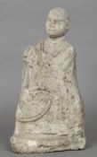 A Chinese Ming stone model of a deity Formed seated with clasped hands. 47 cm high.