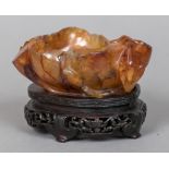 A 19th century Chinese carved hardstone brush washer, possibly Carnelian Worked as a lily pad,