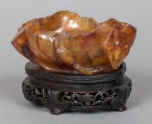 A 19th century Chinese carved hardstone brush washer, possibly Carnelian Worked as a lily pad,